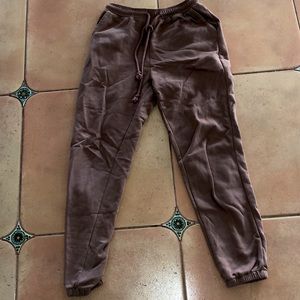 Tan jogging pants. Thick material. Very stylish. ONLY WORN ONCE